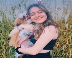 The star has adopted a cute dog named Luke in her home and loves to play with him.